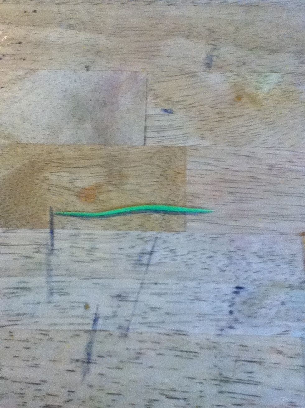 Grab the green and roll it out very skinny like so.