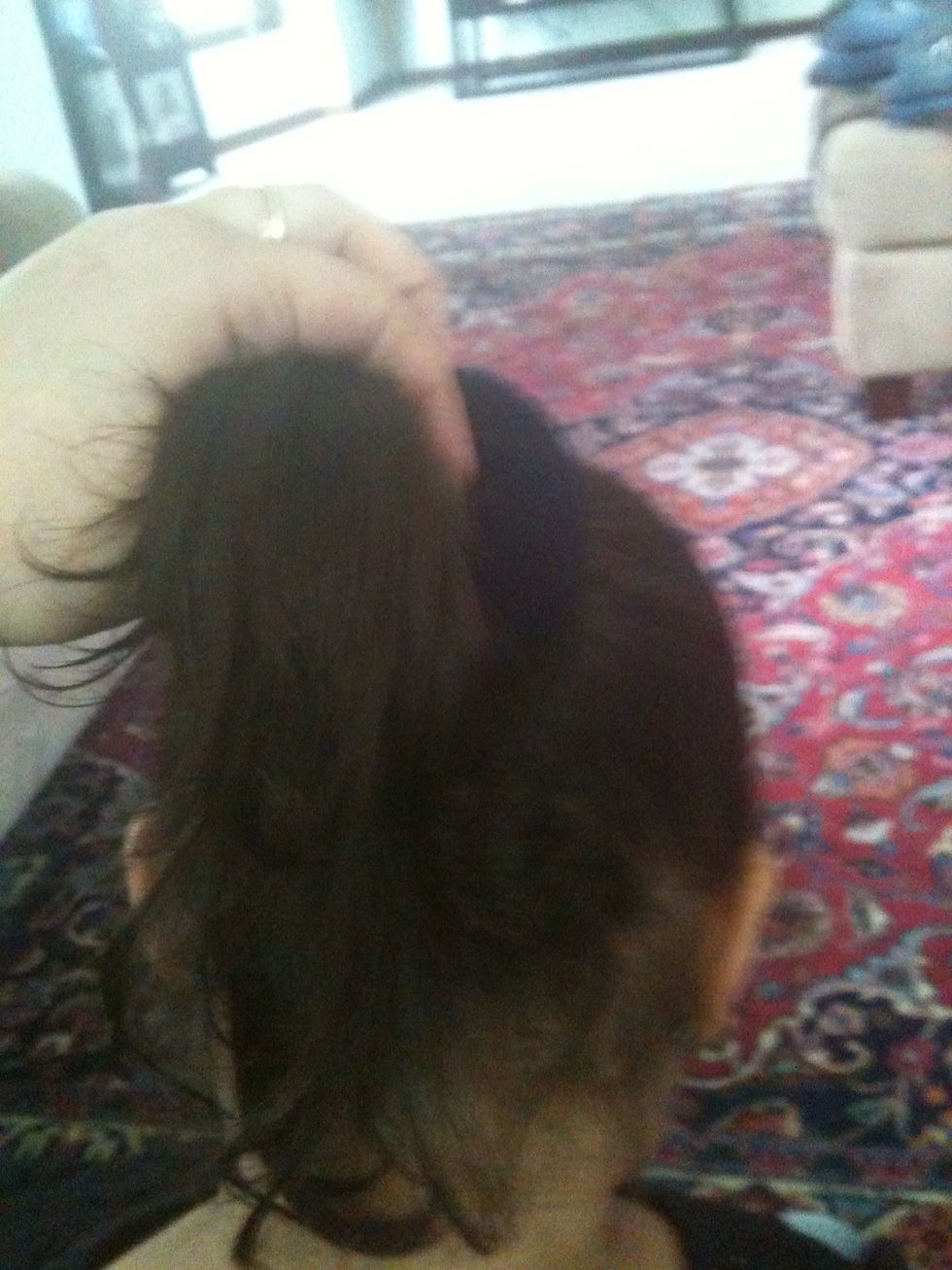 Grab the hair and brush it down so it covers the sock