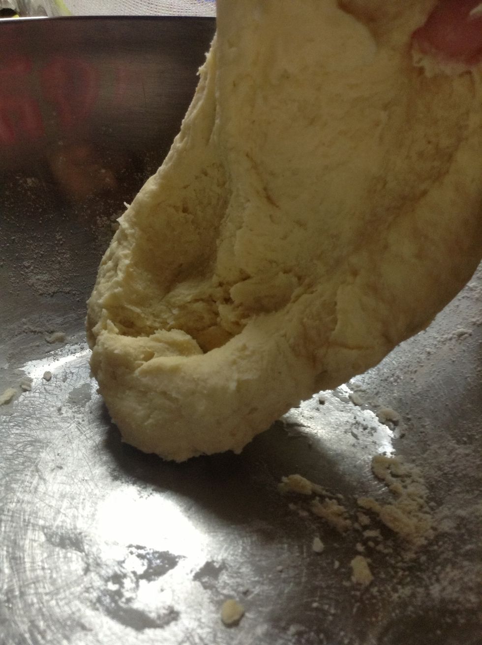 Grab the mix and start kneading the dough it into a ball.