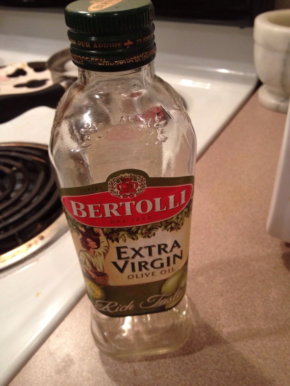 Grab the olive oil. She can use vegetable oil instead if desired.