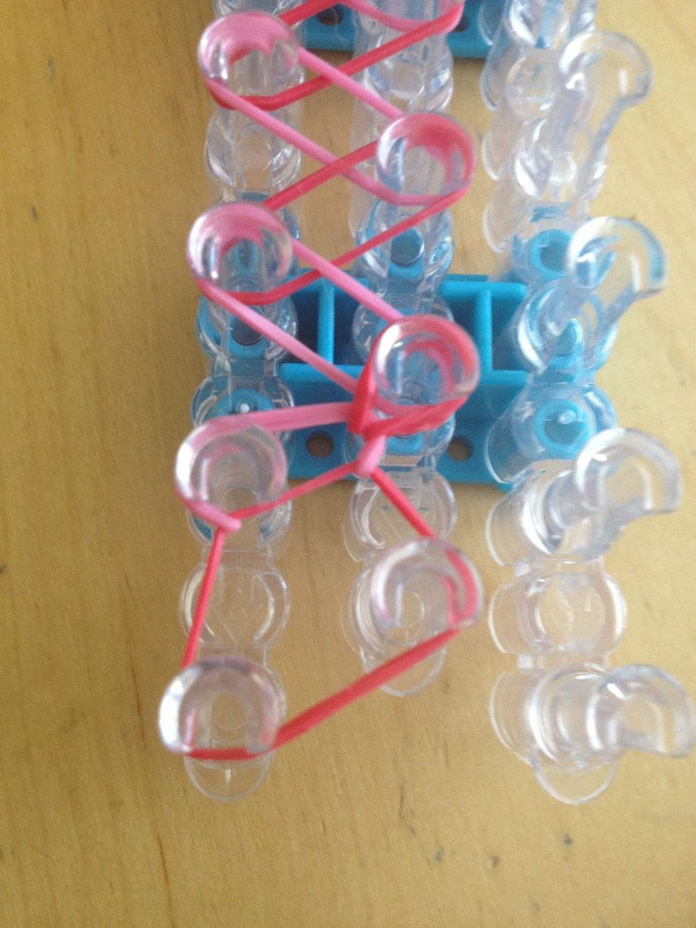 Grab the red under the pink and hook it back to where it came from.