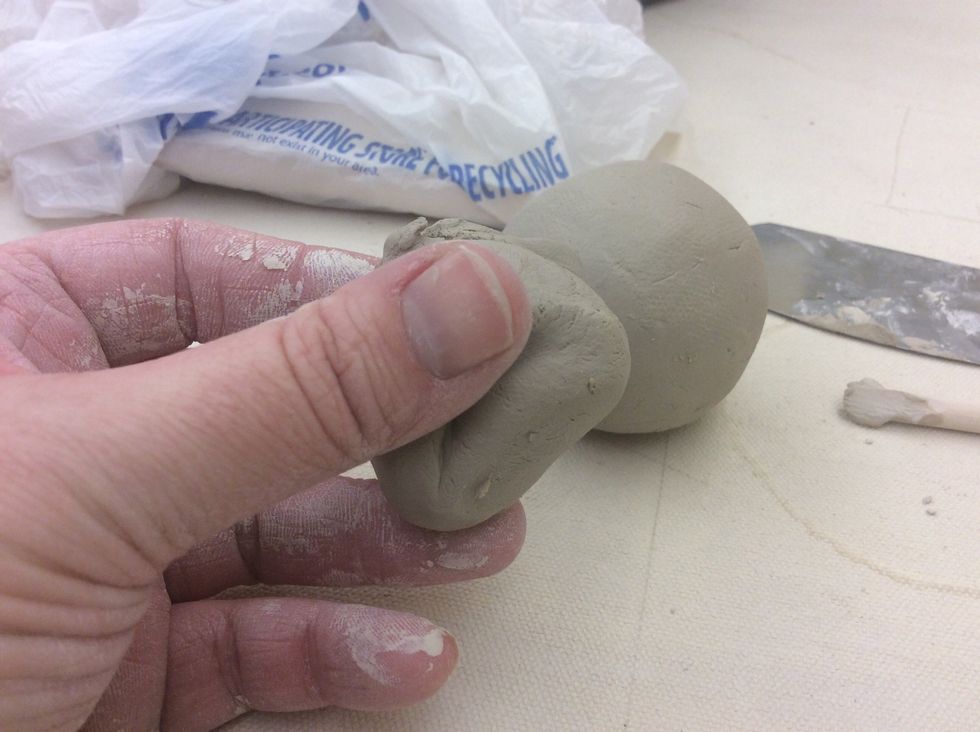 Grab the small ball of clay you tore off earlier.