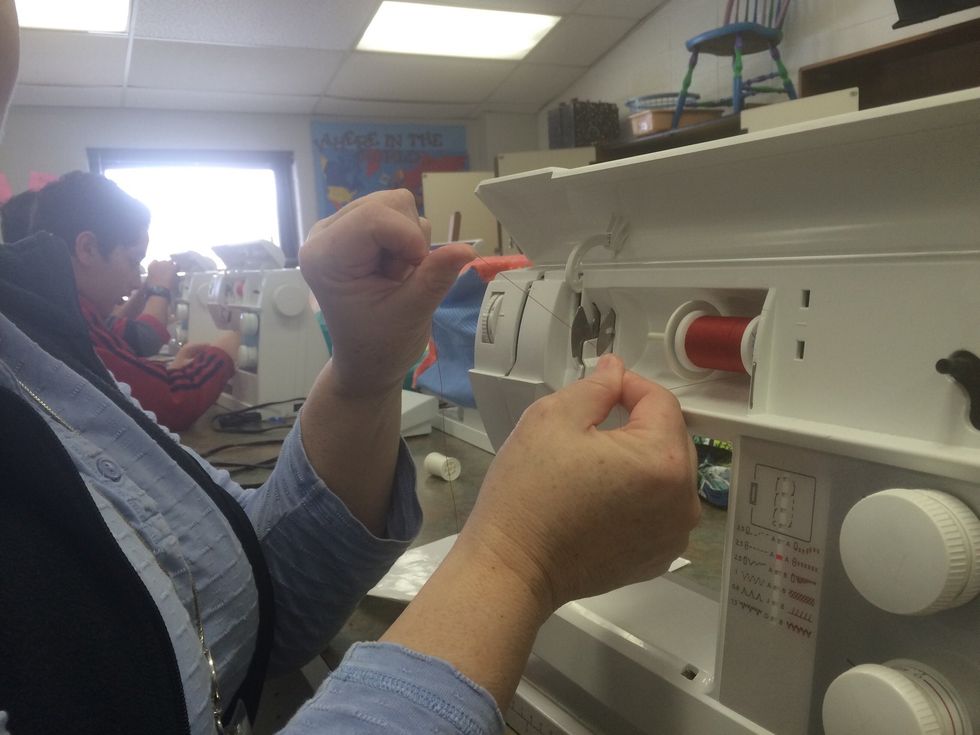 Grab the thread between your fingers and make sure it is taunt