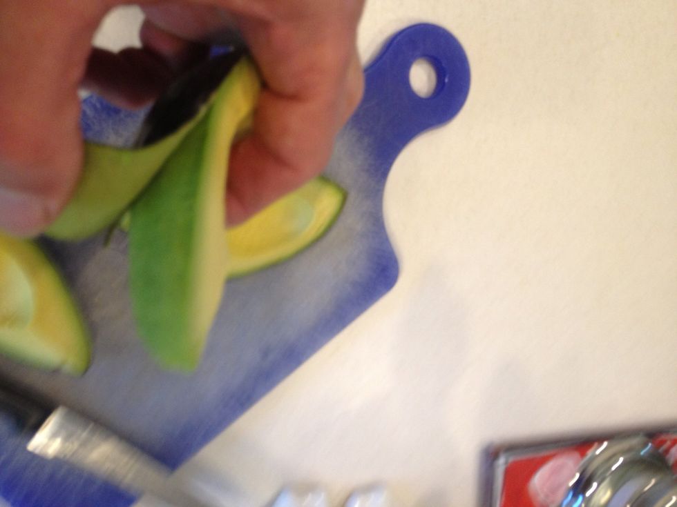 Grab the tip of the skin at the narrow end and peel it off.