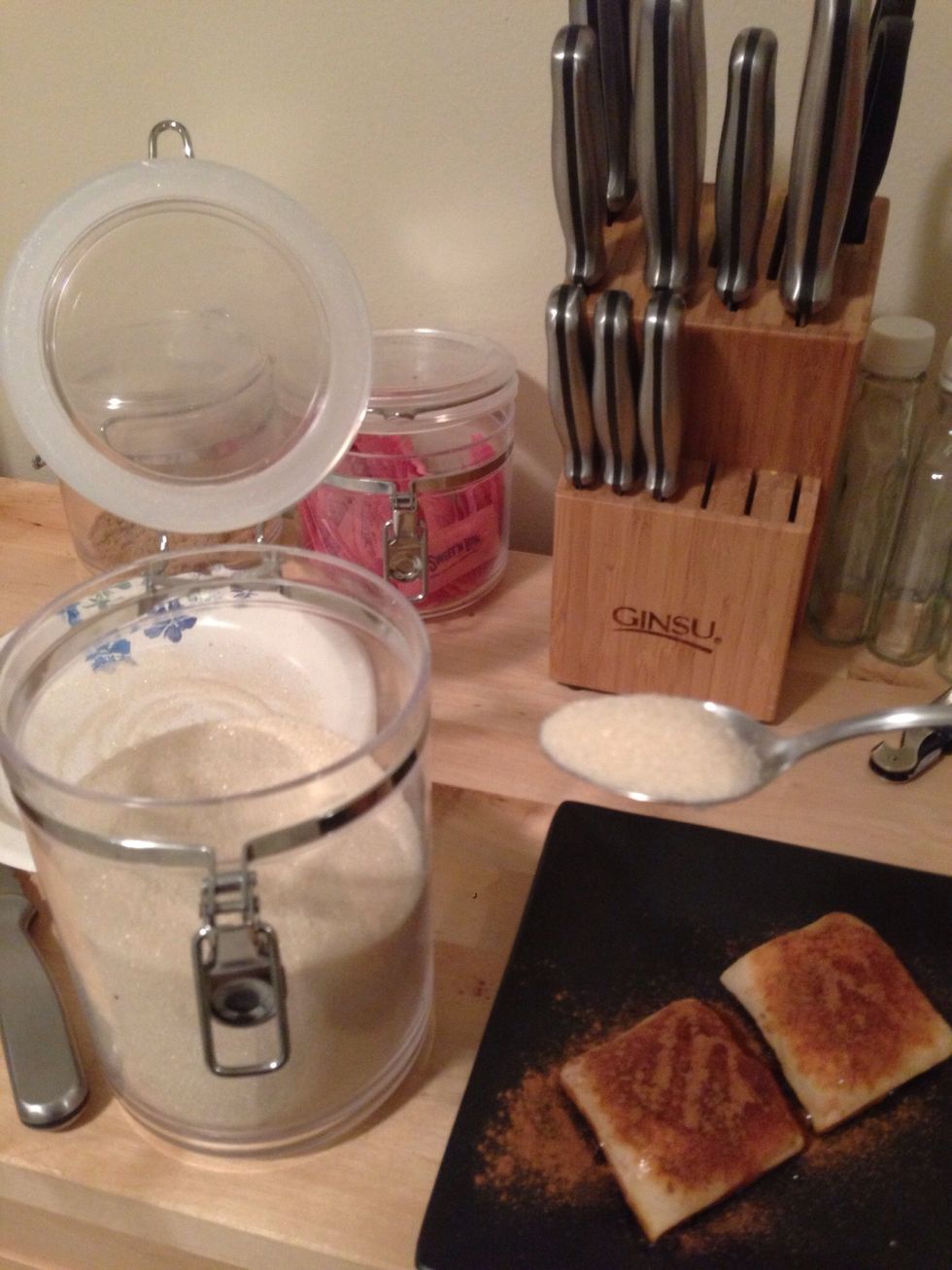 Grab the white sugar and add to the top of the sopapillas.