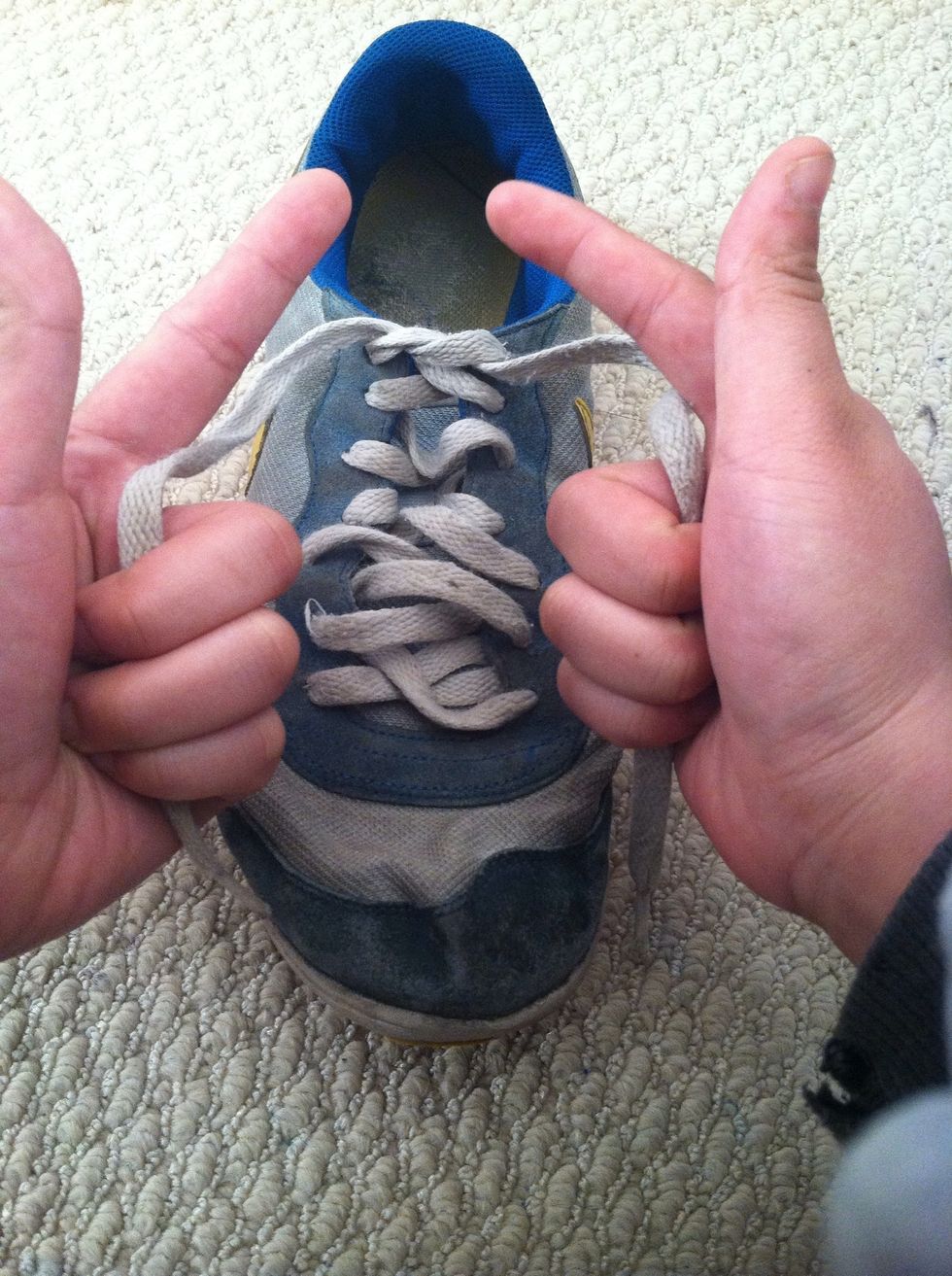 Grab those laces and make a gun gesture..