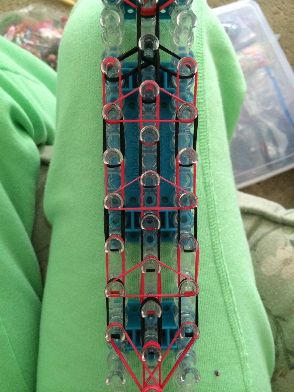 Grab three red rubber bands and make three more triangles