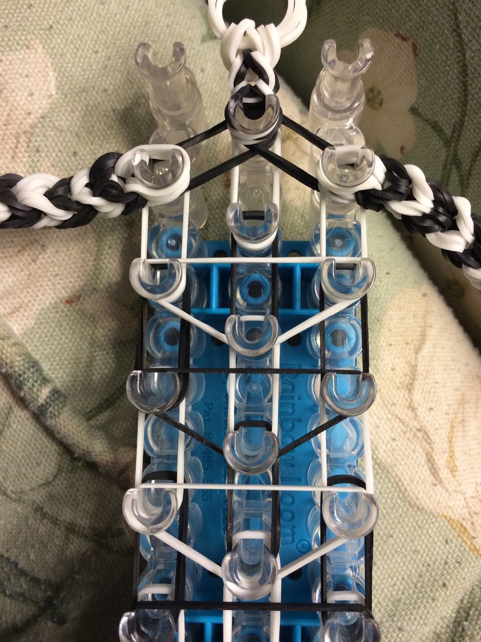 Grab two more white bands and make another upside down triangle