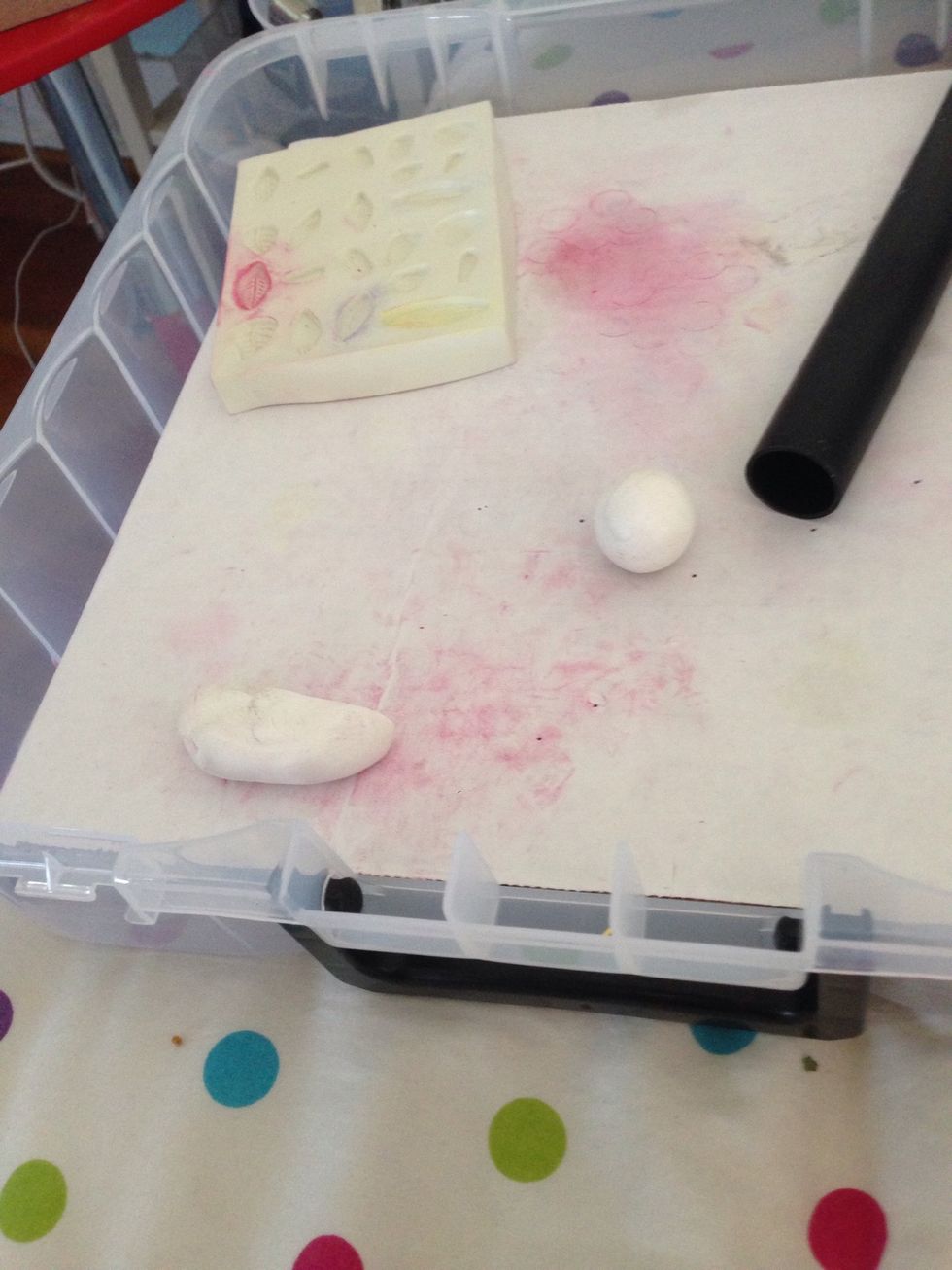 Grab white polymer clay and knead so it's soft and then roll it into a ball.