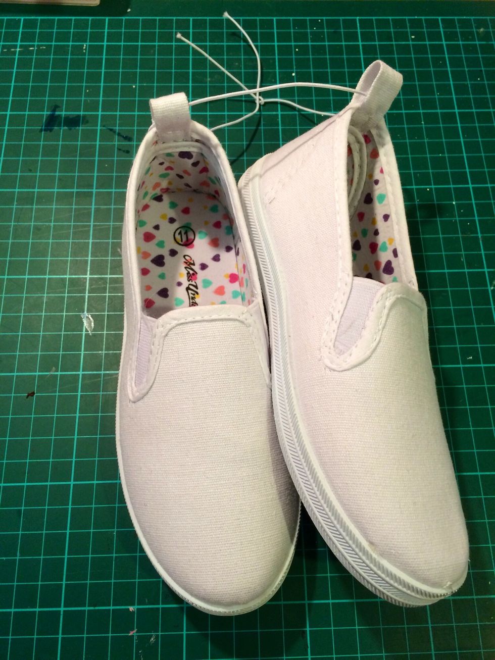 Grab you plain canvas shoes. They don't have to be white, stamping and painting on any colour would look great.