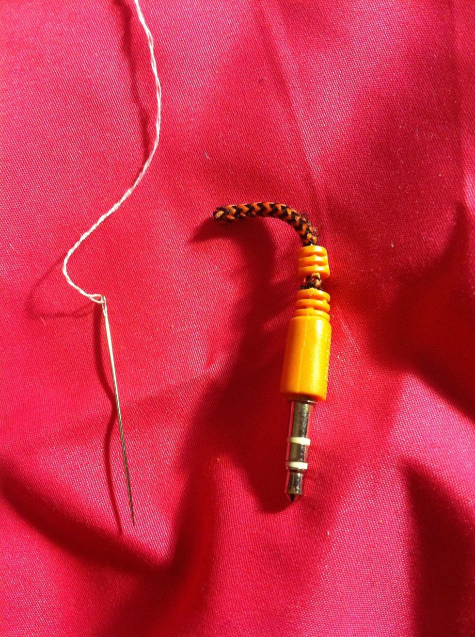 Grab you're needle with string (I used two inches of string you can use more if you want a stronger hold) {more as in the length of you're wrist to elbow}