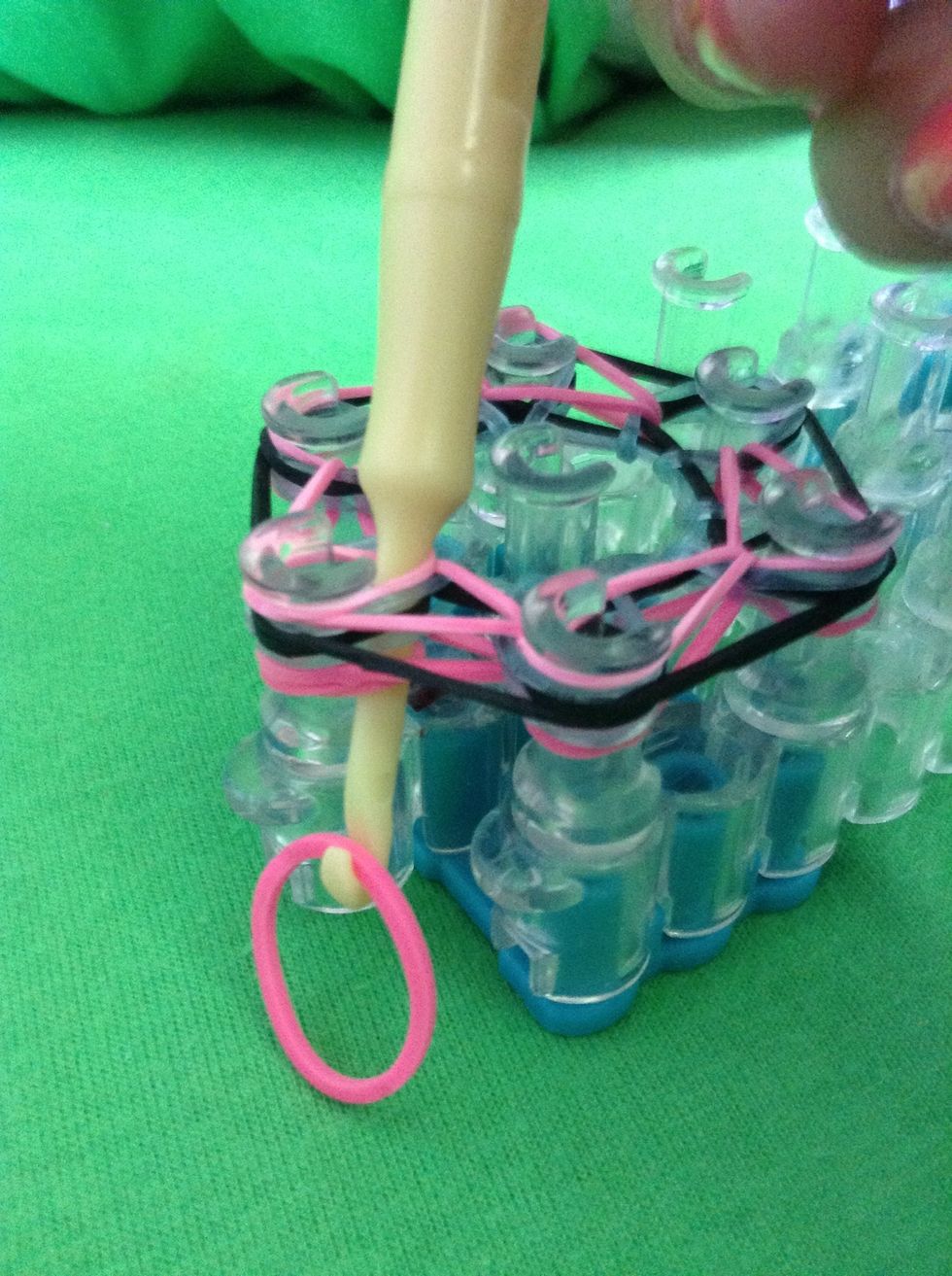 Grab your 20th band and stick it on the hook like so