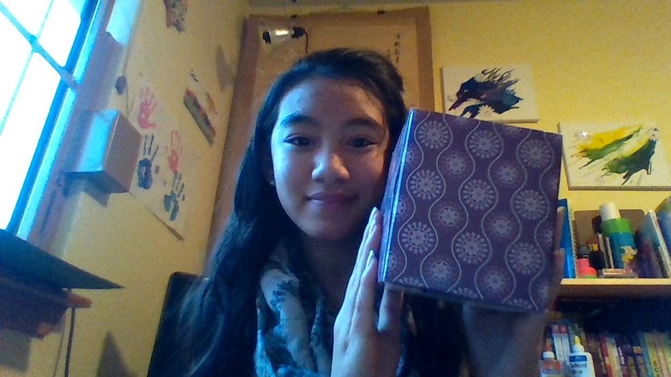 Grab your empty tissue box and cut out all of the pieces of plastic covering the tissue opening