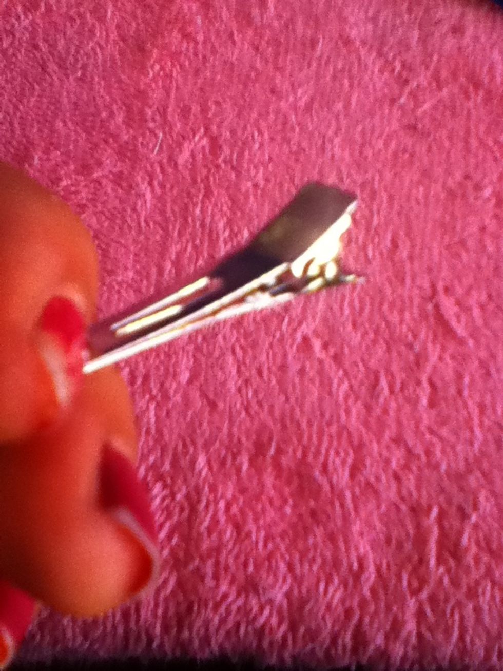 Grab your hair clip and it can be an alligator clip or any clip you prefer.