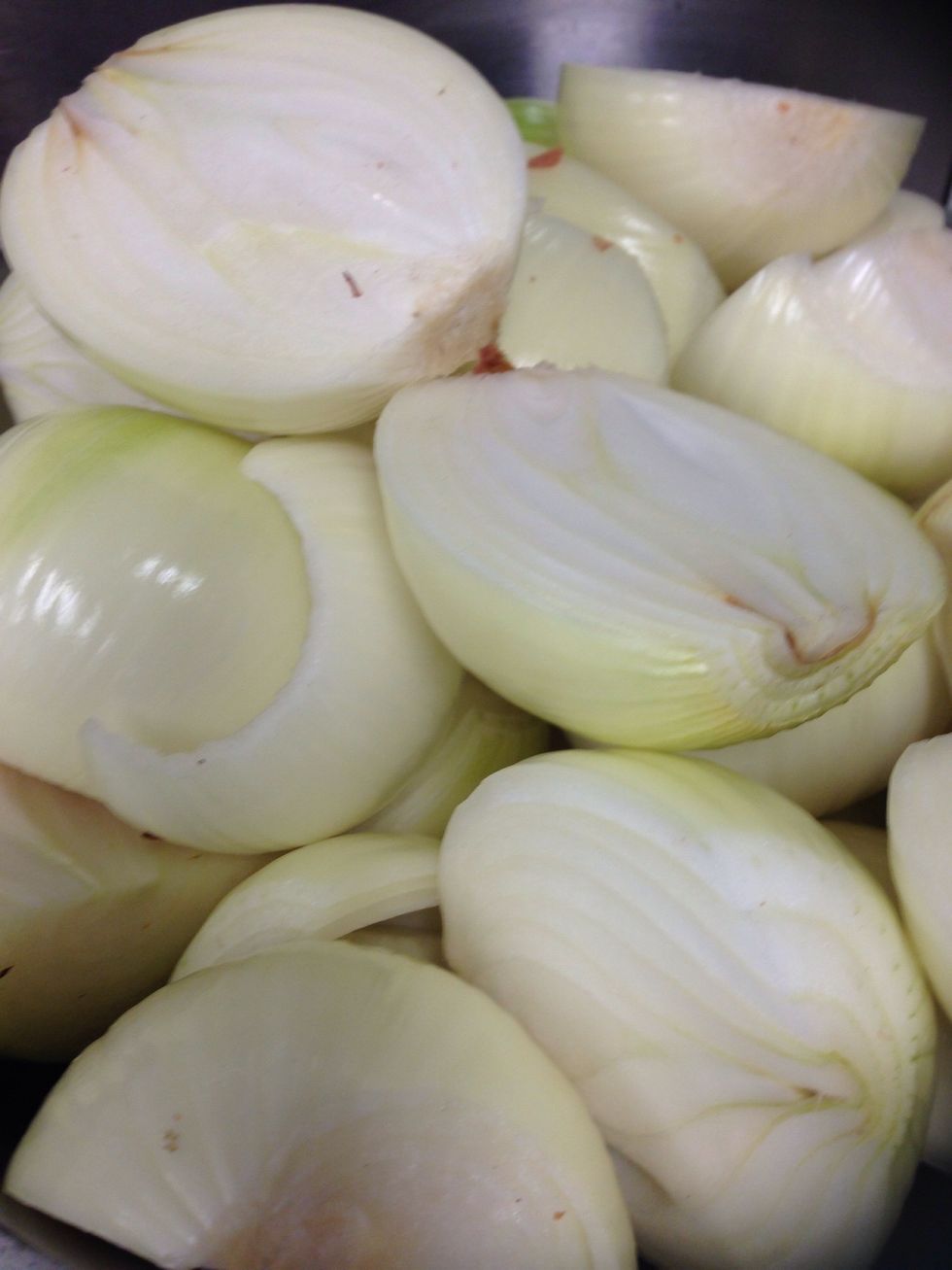 Grab your onion and cut it into half.