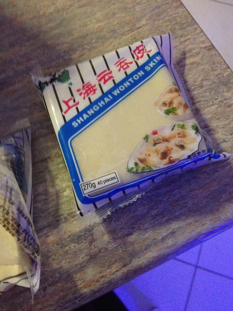 Grab your pastry packs, a small bowl of water (to dab your finger in) and a large plater to put all of your wontons on (you'll have about 70-80).