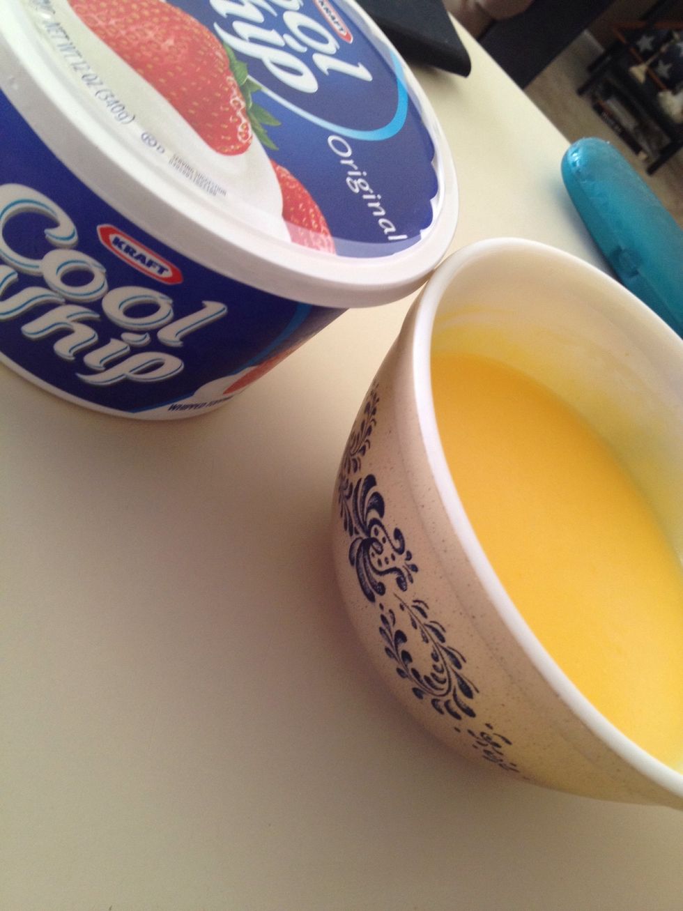 Grab your pudding mixture and your cool whip. Pudding will be stiff.