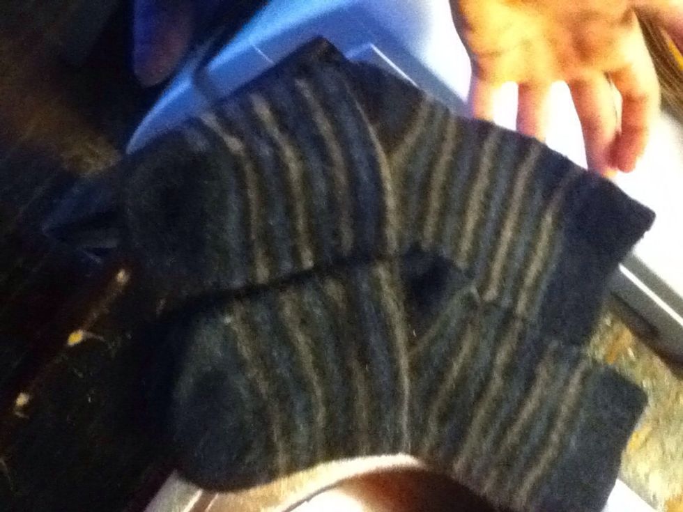 Grab your shrunken socks/jumper and place them in a bucket of warm water