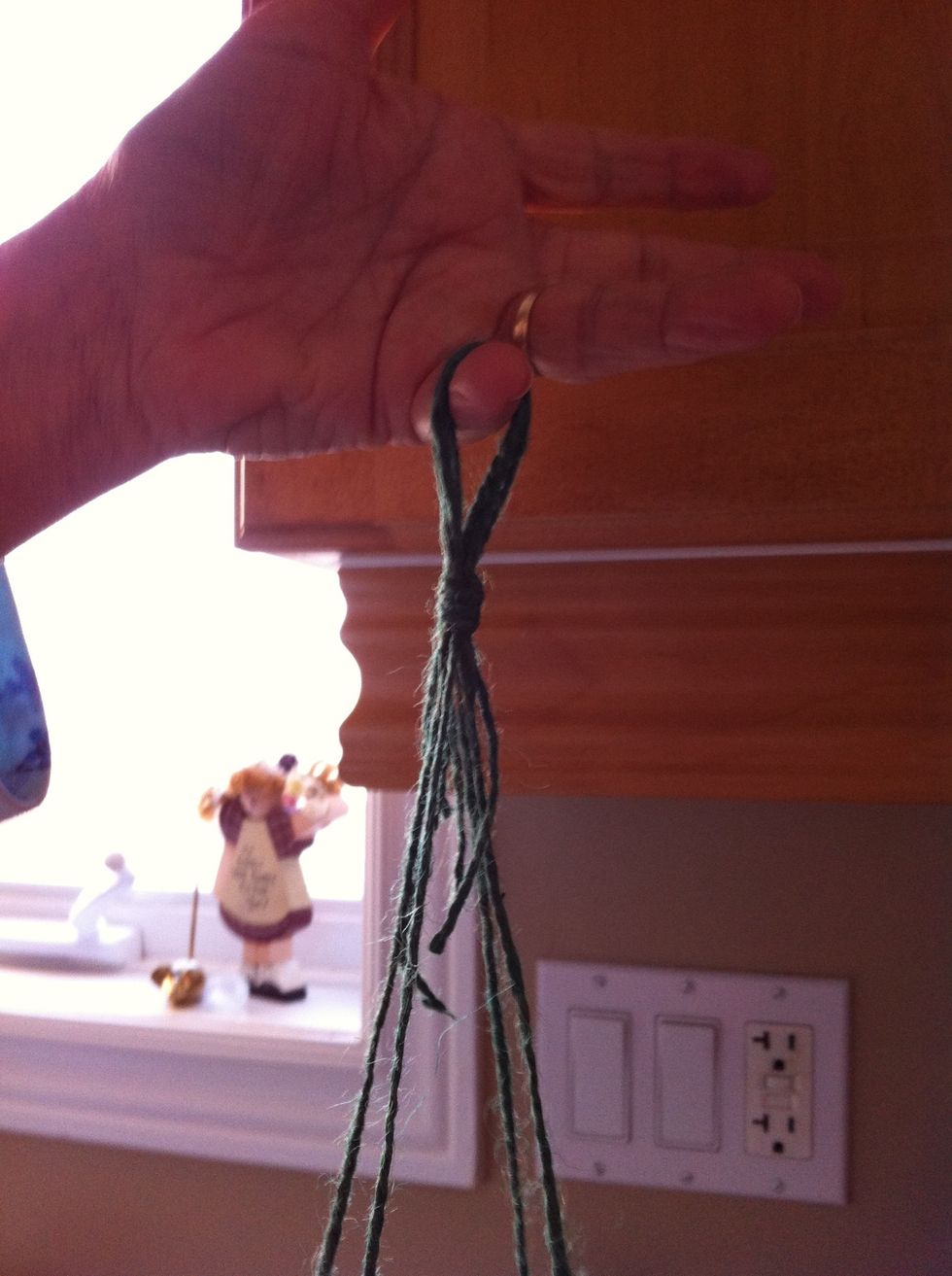 Grab your strings near the top and make a slip knot, so you have a loop