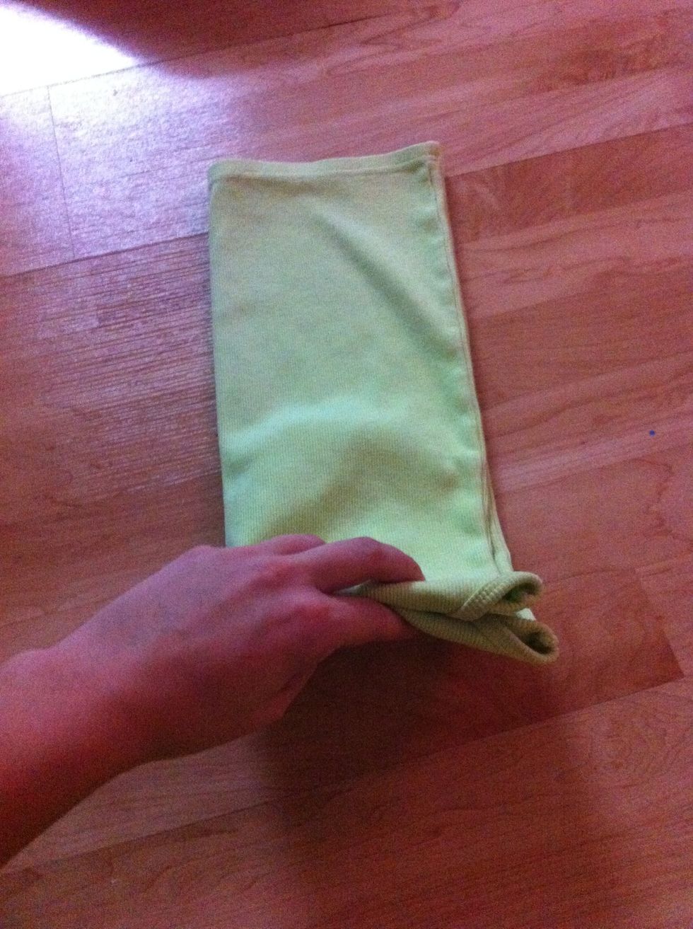 Grabbing the end the straps are hiding in, fold I'm half upward