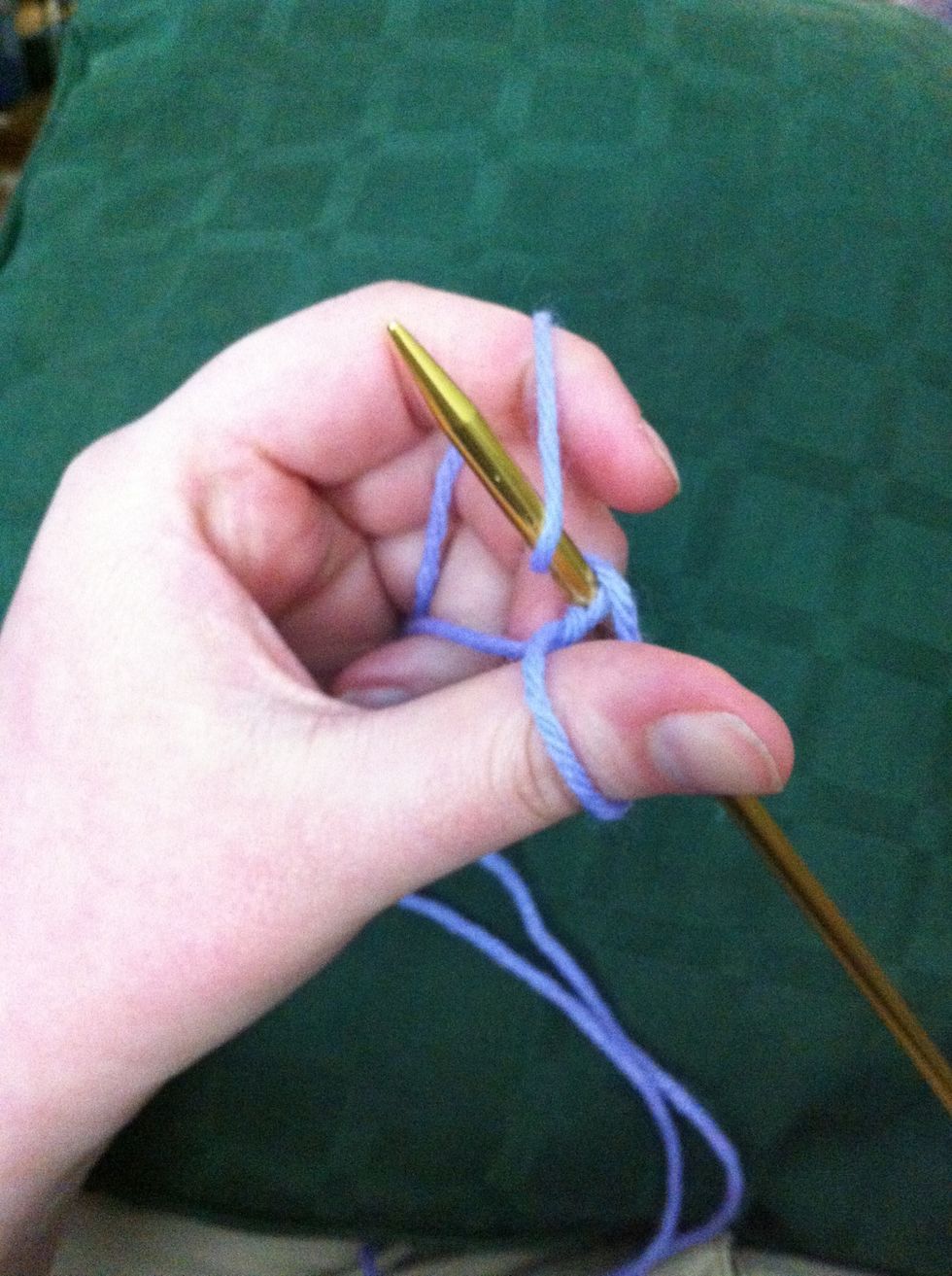 grabbing the yarn with the needle