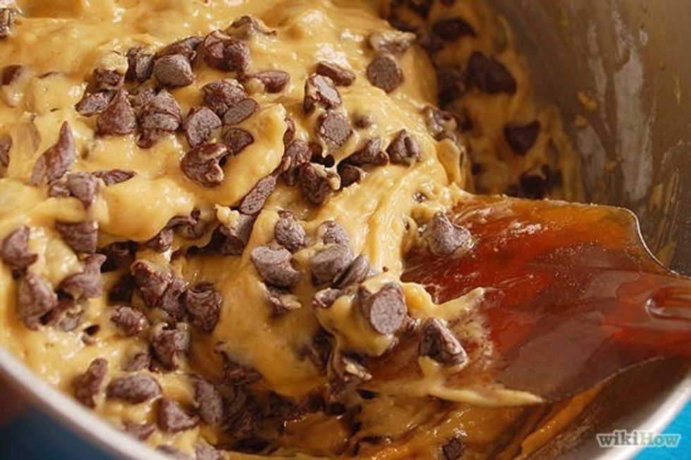 Gradually a cup at a time add the dry ingredients from the medium bowl to the wet ingredients in the large bowl, then add chocolate chips. Pour a cup of the dry ingredients.