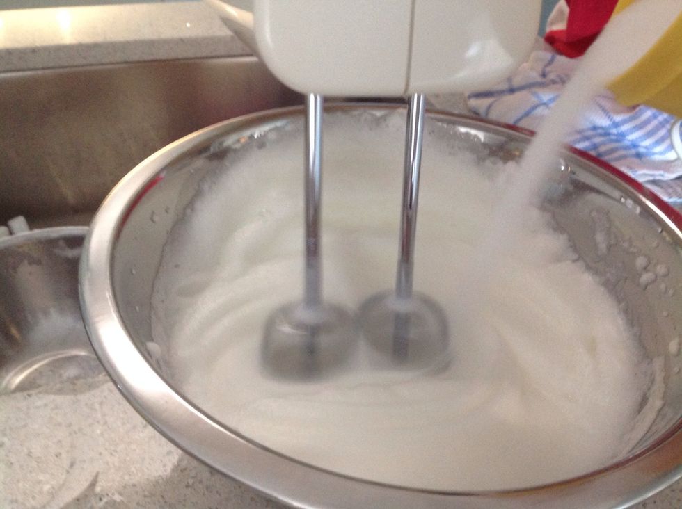 Gradually add caster sugar whilst whisking the egg whites, making sure the caster sugar is totally dissolved.