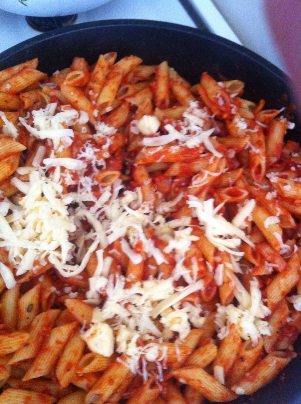 Gradually add cheese. Make sure not to over cook it. The cheese WILL burn!