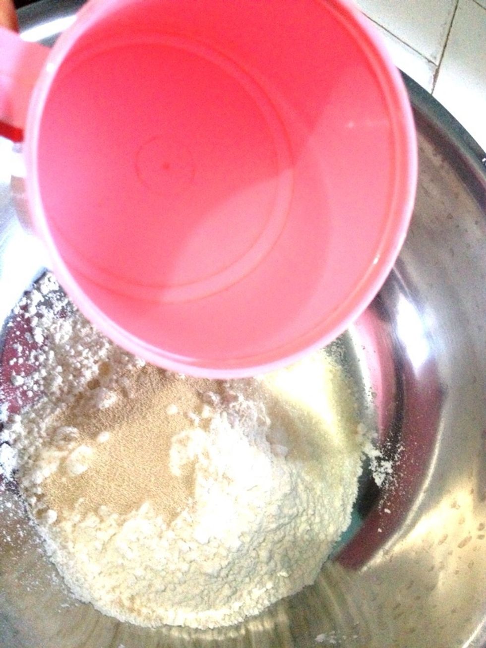 Gradually add in 1/2 cup of warm water until you get smooth and slightly sticky dough. If you happen dont have instant yeast and use the dried one, jump to next guide