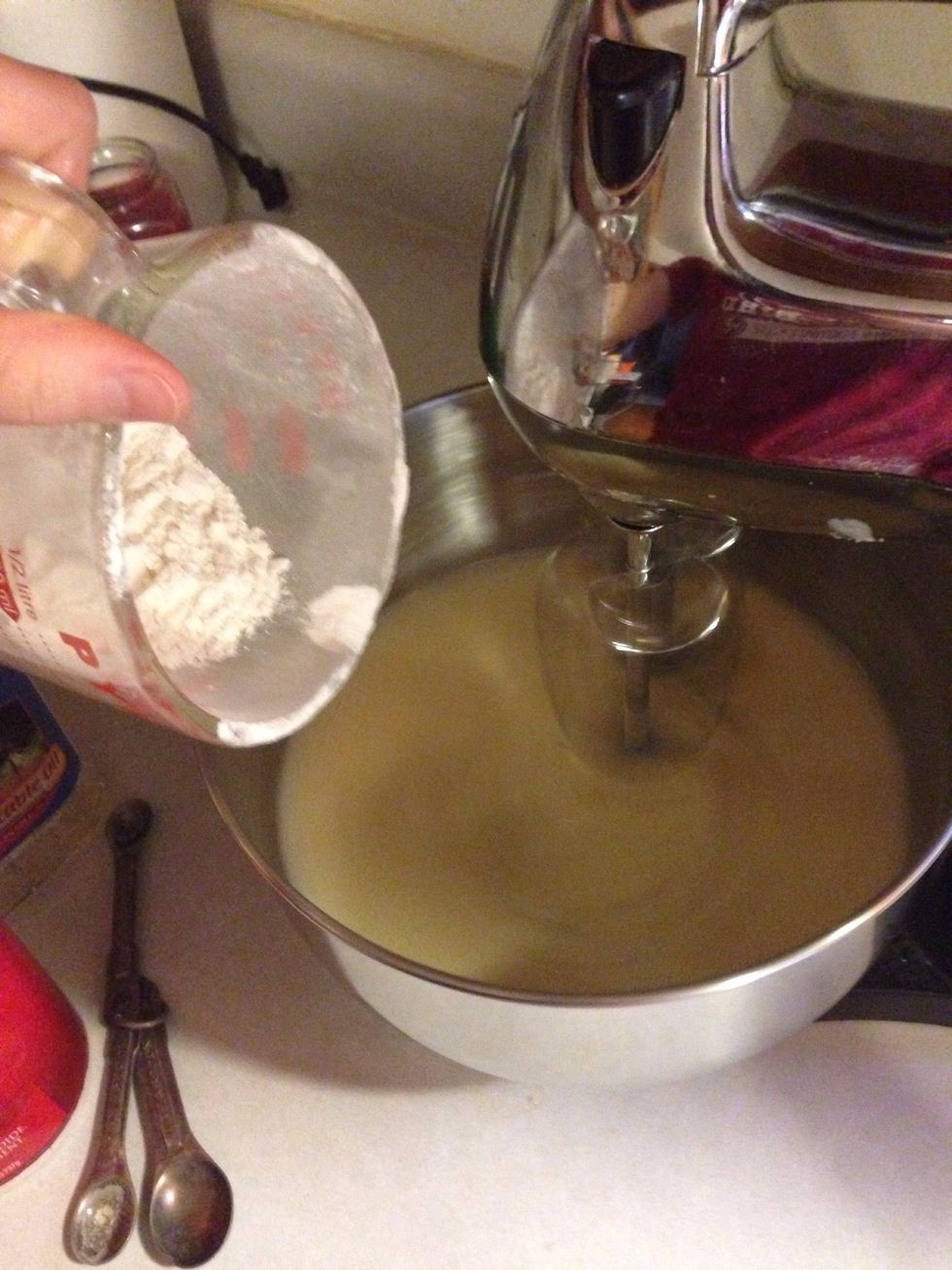 Gradually add in the flour while mixer is still moving at a medium speed