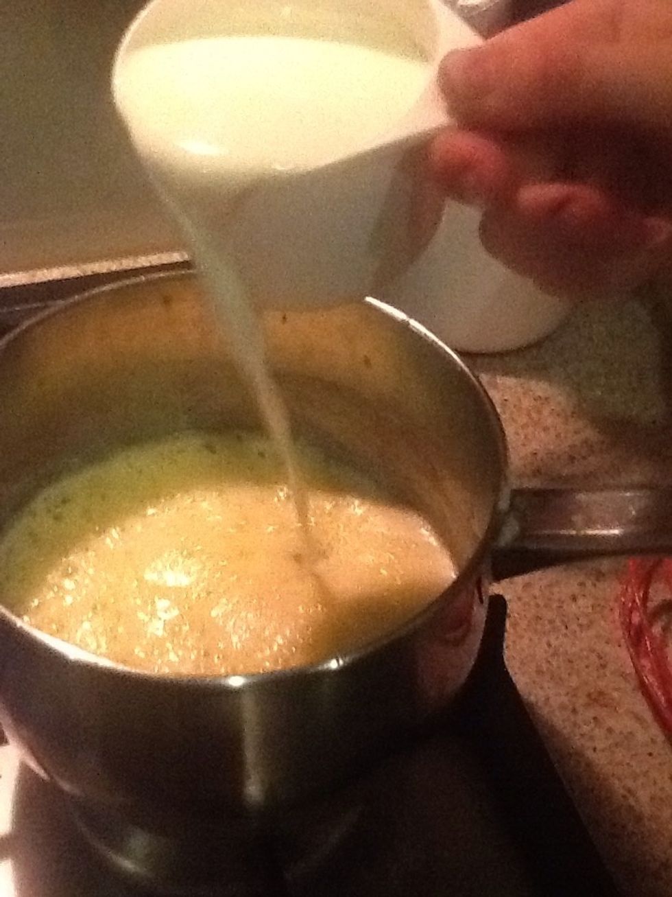 Gradually add milk, stirring until smooth. Stir until the mixture  starts to boil, reduce heat and simmer for 2 minutes.