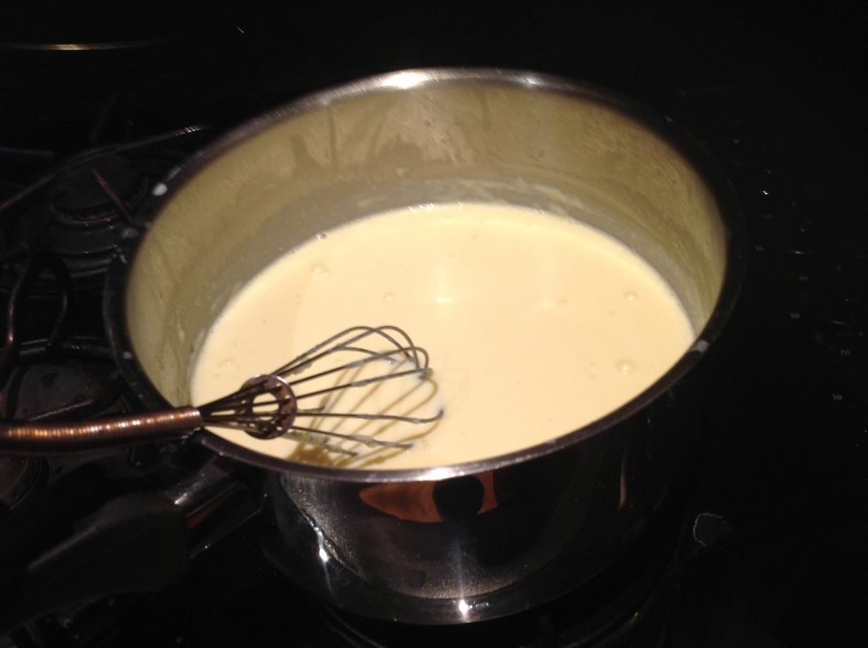 Gradually add milk whisking continually