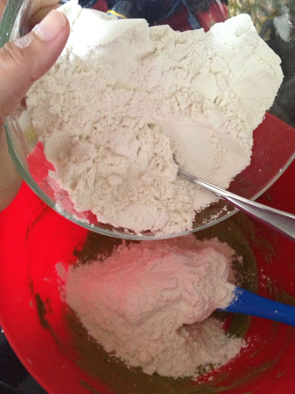Gradually add the flour mixture to the butter mixture half at a time until combined and the dough comes together.