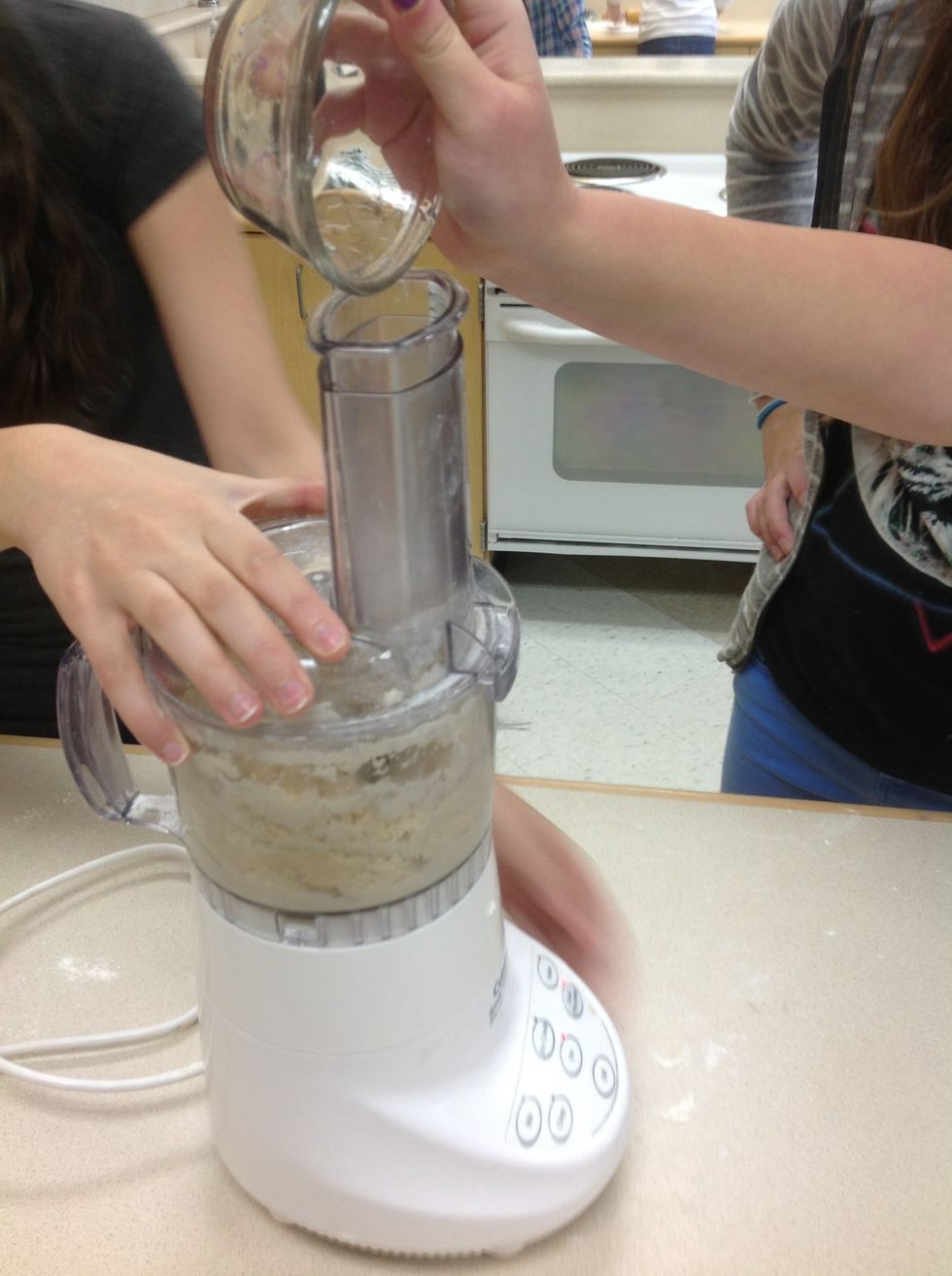 Gradually add water to food processor