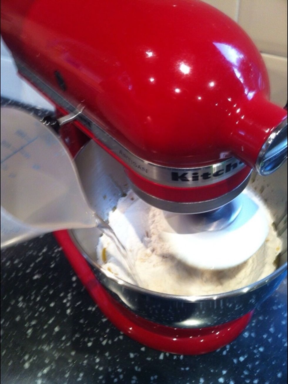 Gradually add water to the mix. You may need slightly more or less than 300ml depending on the flour and room humidity.