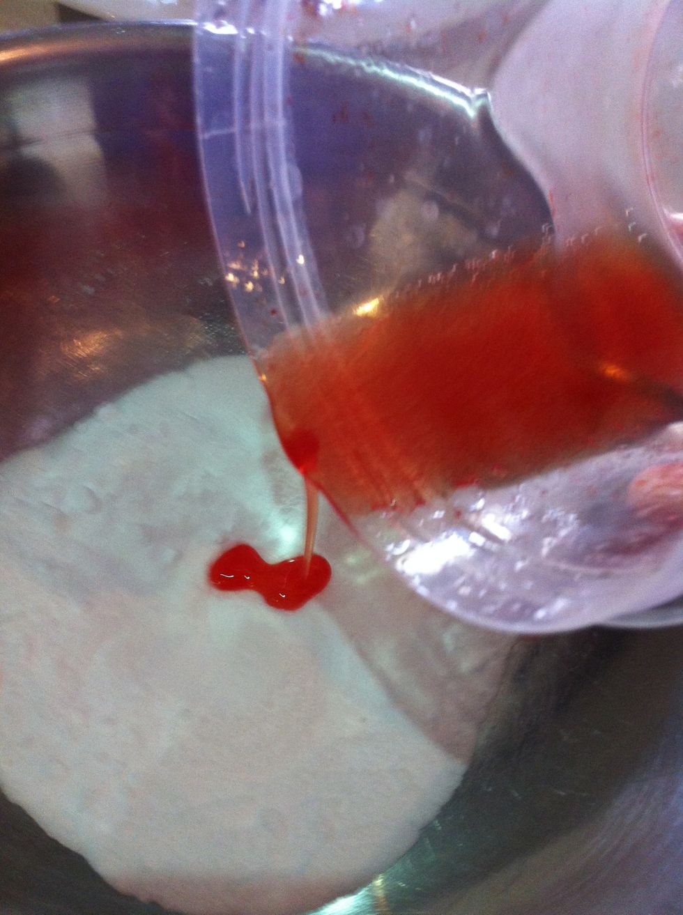 Gradually pour the oil mixture into the half cup of base mixture.