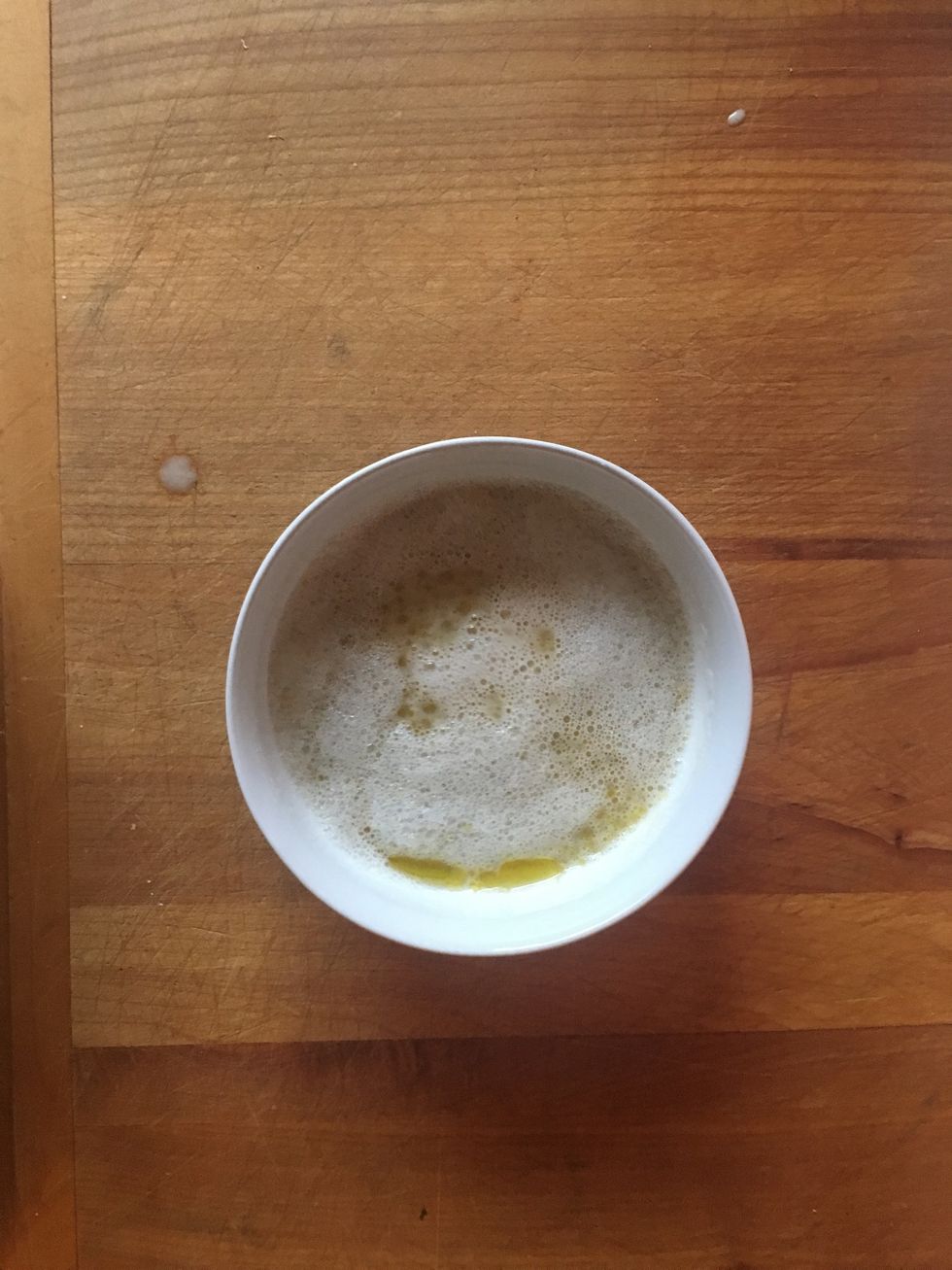 Gradually stir the yeast mixture into a separate bowl with cooking oil and salt