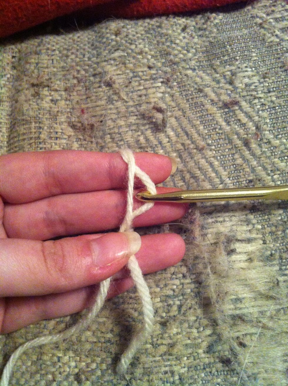 grap the second (inner) loop and pull trough the first (outer) loop