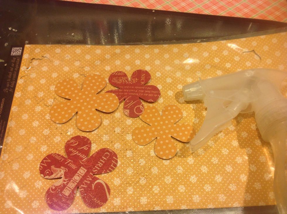 Graphic 45 has coordinating flower punch outs to match every collection. Makes it very easy to create flowers. For my cake I used those as well as different punched and die cut flowers.