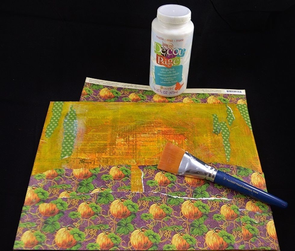 Graphic 45's Abracadabra double sided paper serves double duty - the pumpkin paper gives the illusion of a pumpkin patch and leftover strips add visual interest to the top portion.