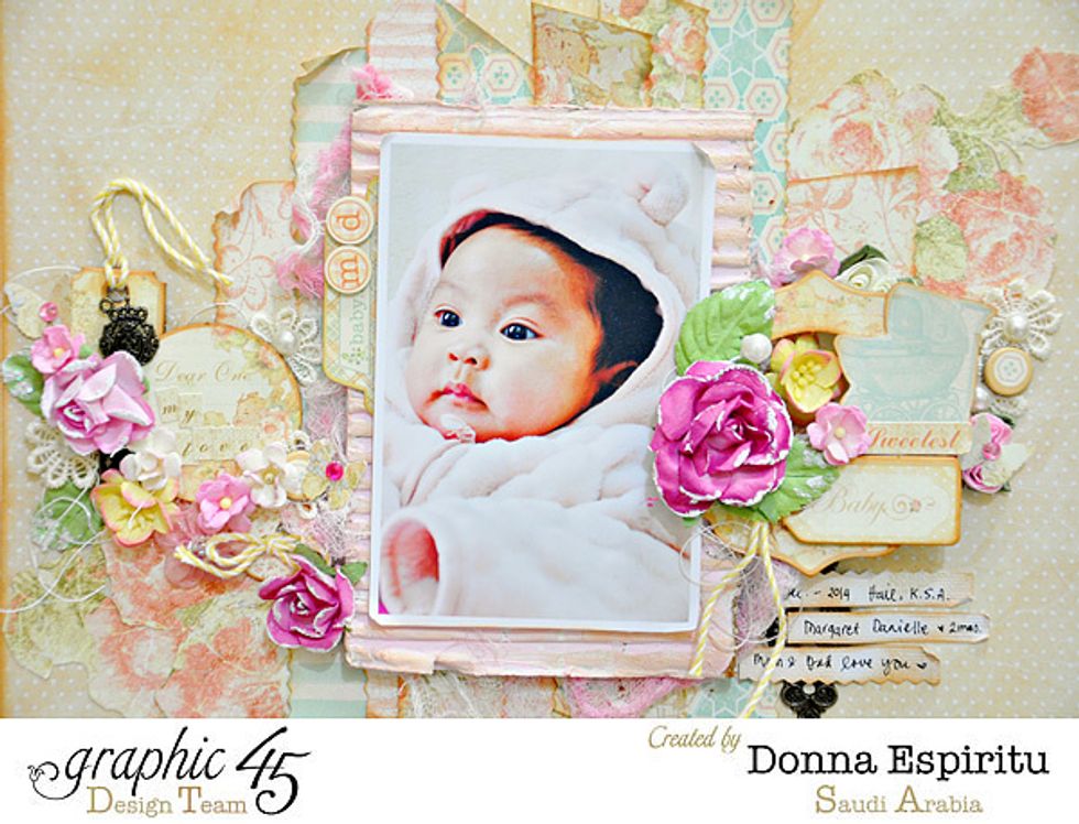 Graphic 45 staples like keys and keyholes added contrast to the soft and delicate colors in the page.