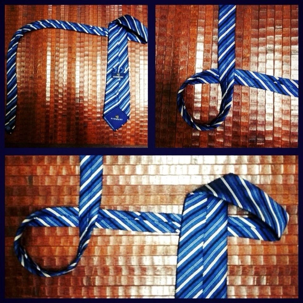 Grasp the other end of the tie then make a circle.