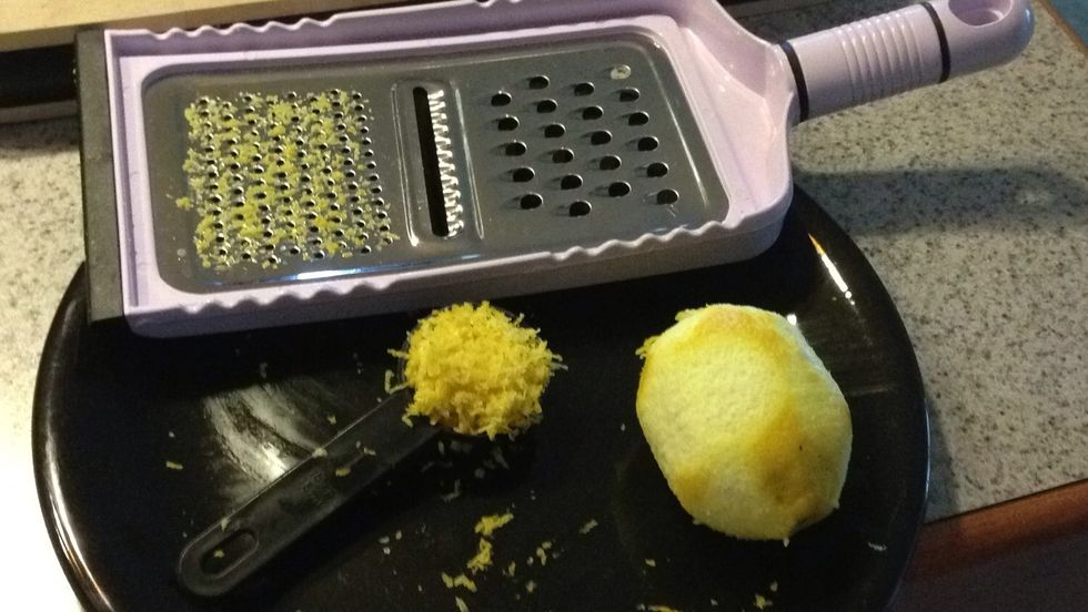 Grate 1 whole lemon.