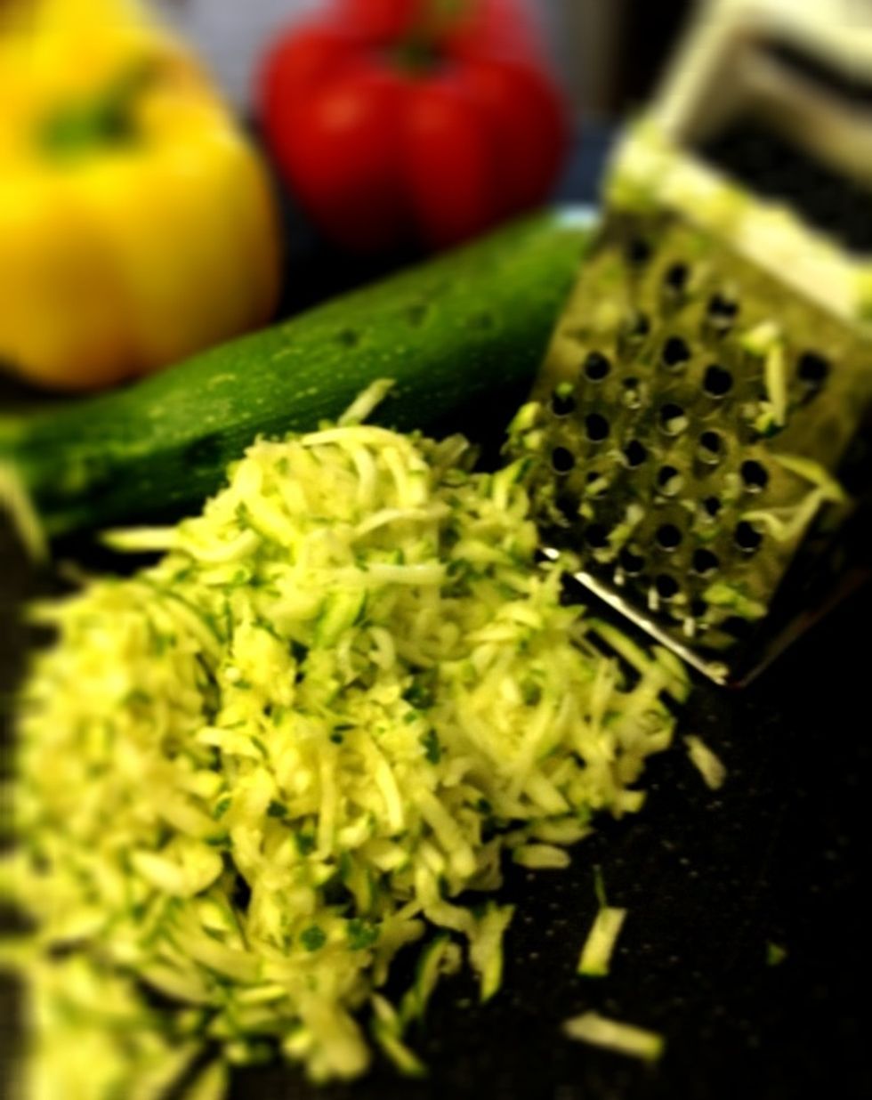 Grate 2 cups of zucchini