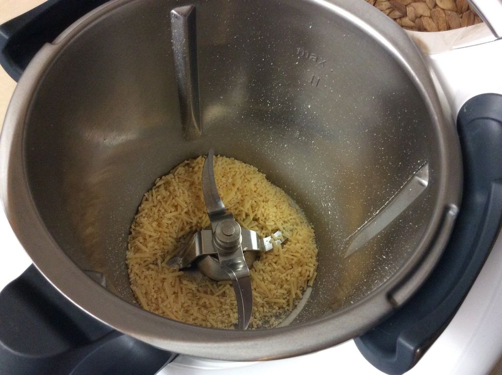 Grate a 50g block of parmesan cheese for 10 seconds on speed 9