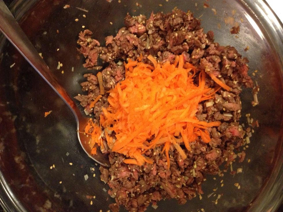 Grate a carrot into fine pieces and mix in with the meat.