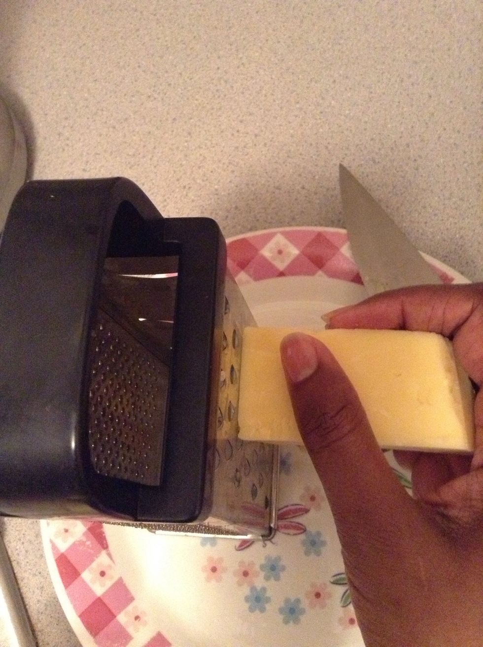 Grate about 1/2 lb of cheese. Be careful with the grater