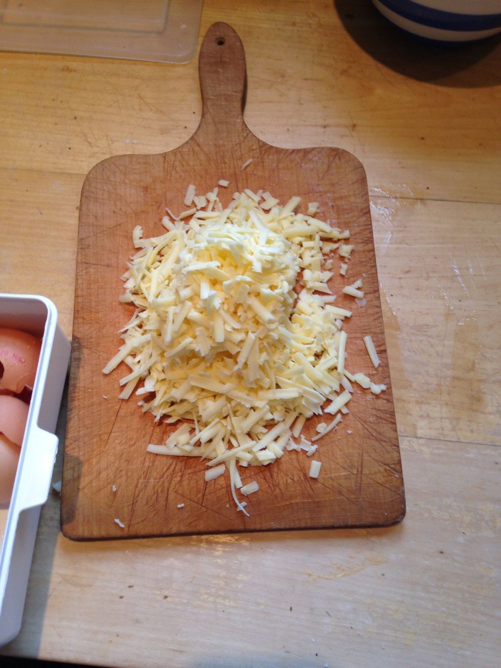 Grate about 200g of strong mature cheddar (mild cheddar doesn't give any flavour) / apparently the French use compte