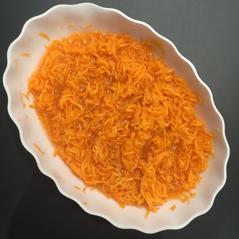 Grate carrots, add the sugar and let stand until sugar had melted and the carrots has rendered its juice