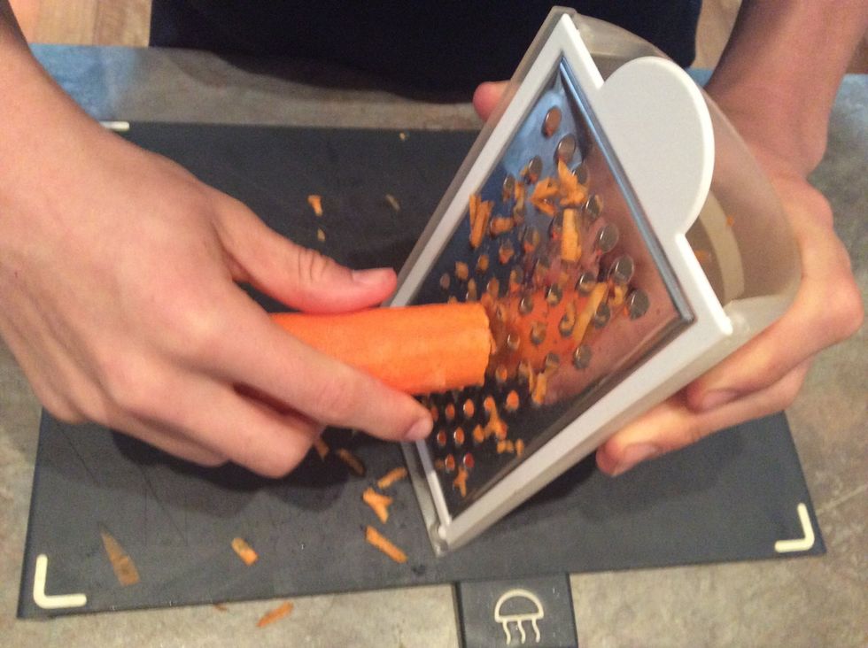 Grate carrots